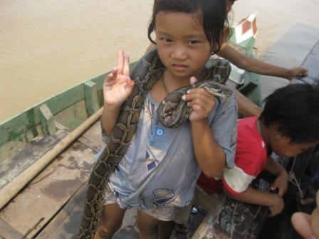 Girl with snake on Ton le Sap River 