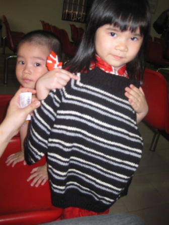 A child gets a jersey in the waiting room 