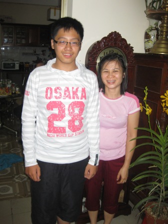 Huong and her son in their home 